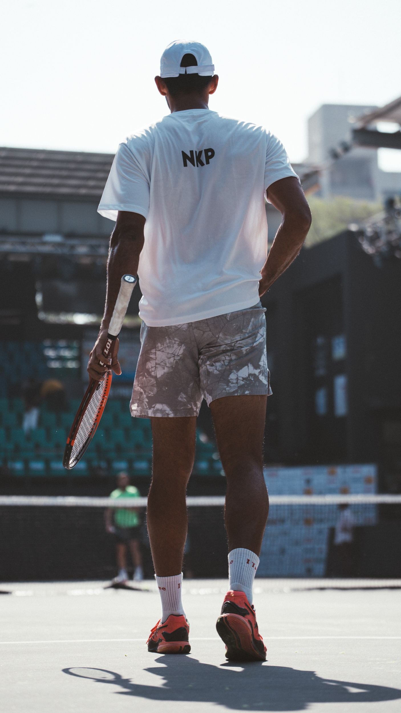 Walking onto court, NKP on his back.